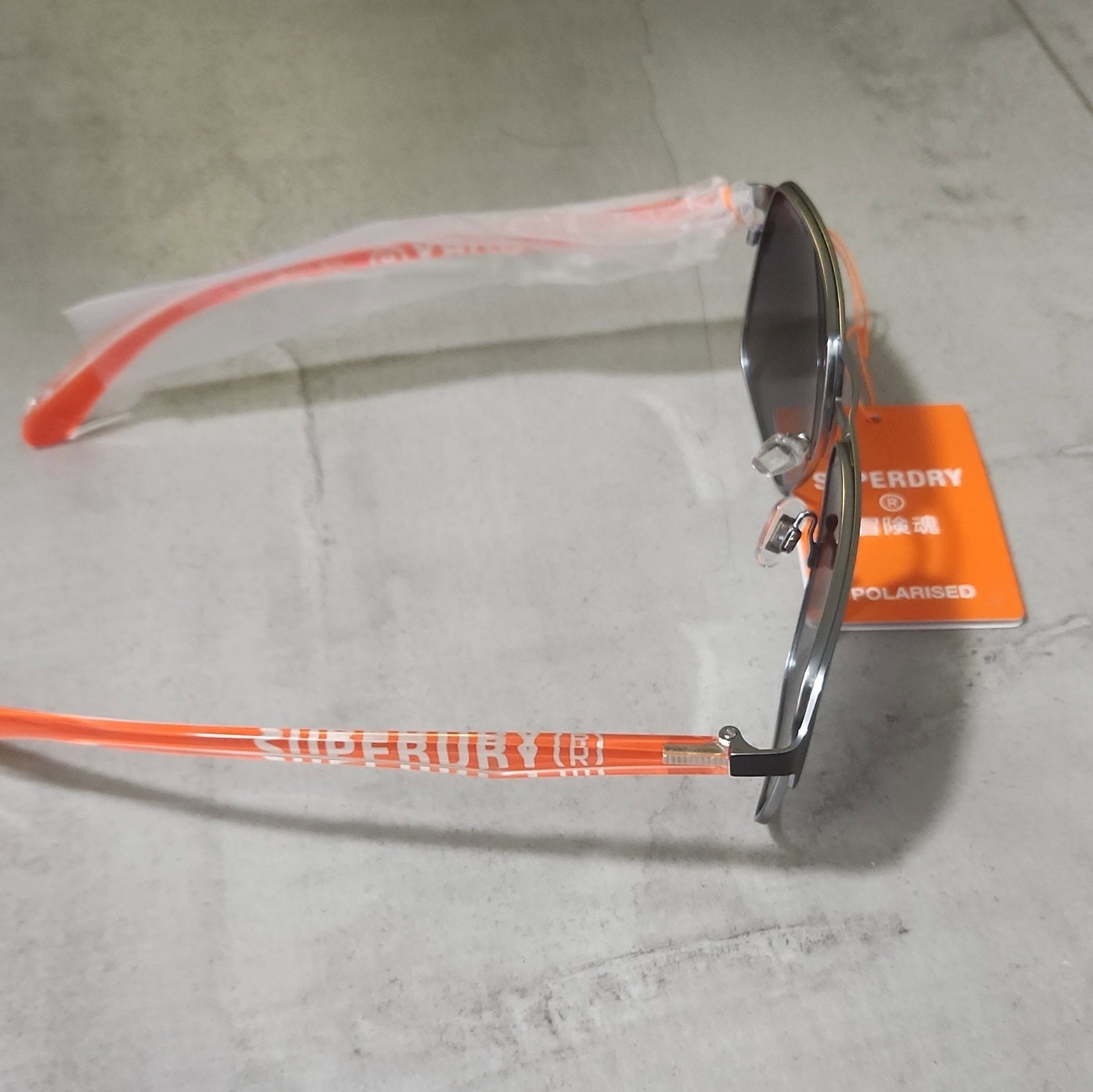 Superdry Polarised Sunglasses with Orange Arms, Superdry, One Size, New condition — preloved on SilentSale®