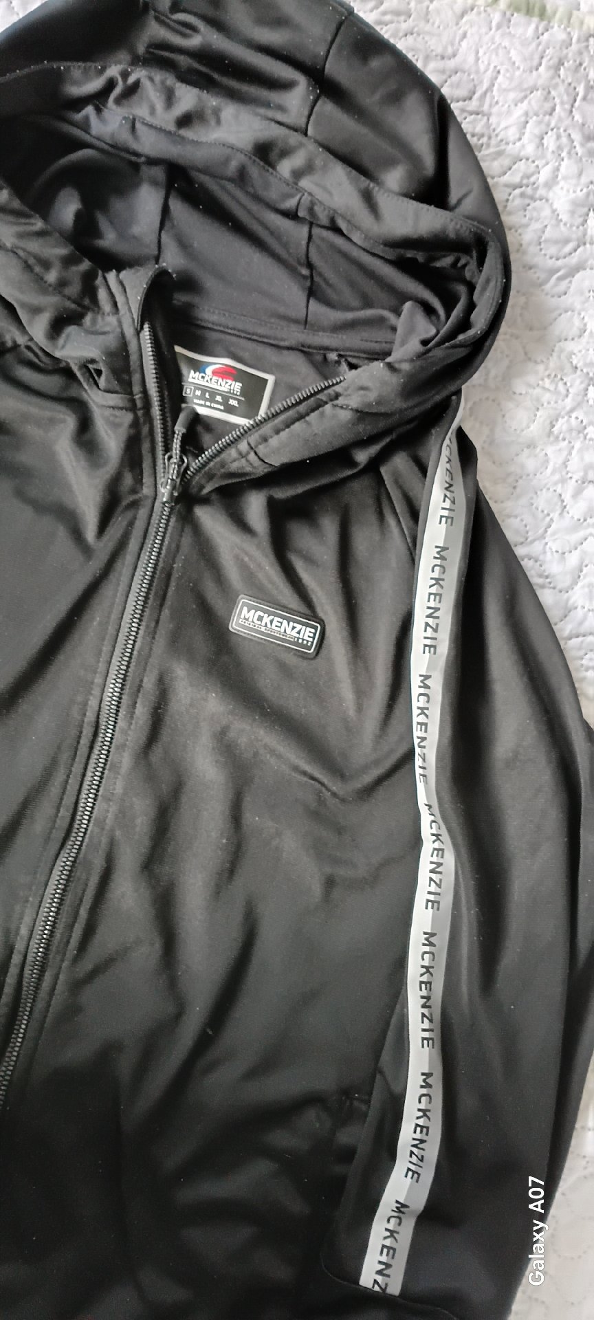 McKenzie Black Zip Up Hoodie with Logo Tape Detail – Size M, McKenzie, M, Excellent condition — preloved on SilentSale®