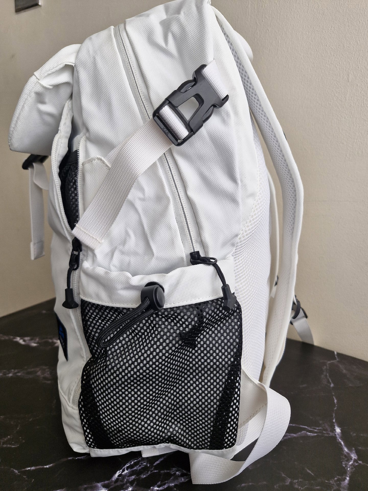 UMGG White Roll Top Backpack with Black Mesh Pockets, Umgg, One Size, New condition — preloved on SilentSale®