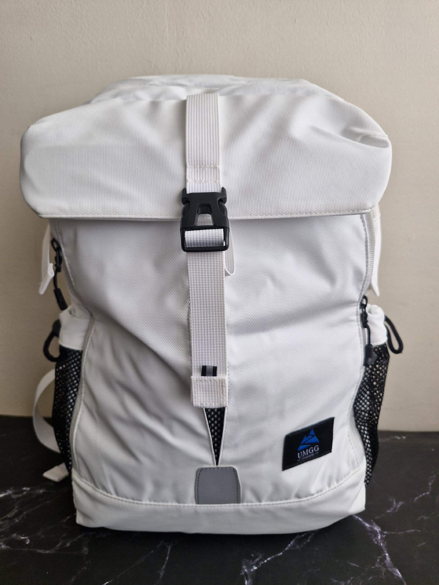 UMGG White Roll Top Backpack with Black Mesh Pockets, Umgg, One Size, New condition — preloved on SilentSale®