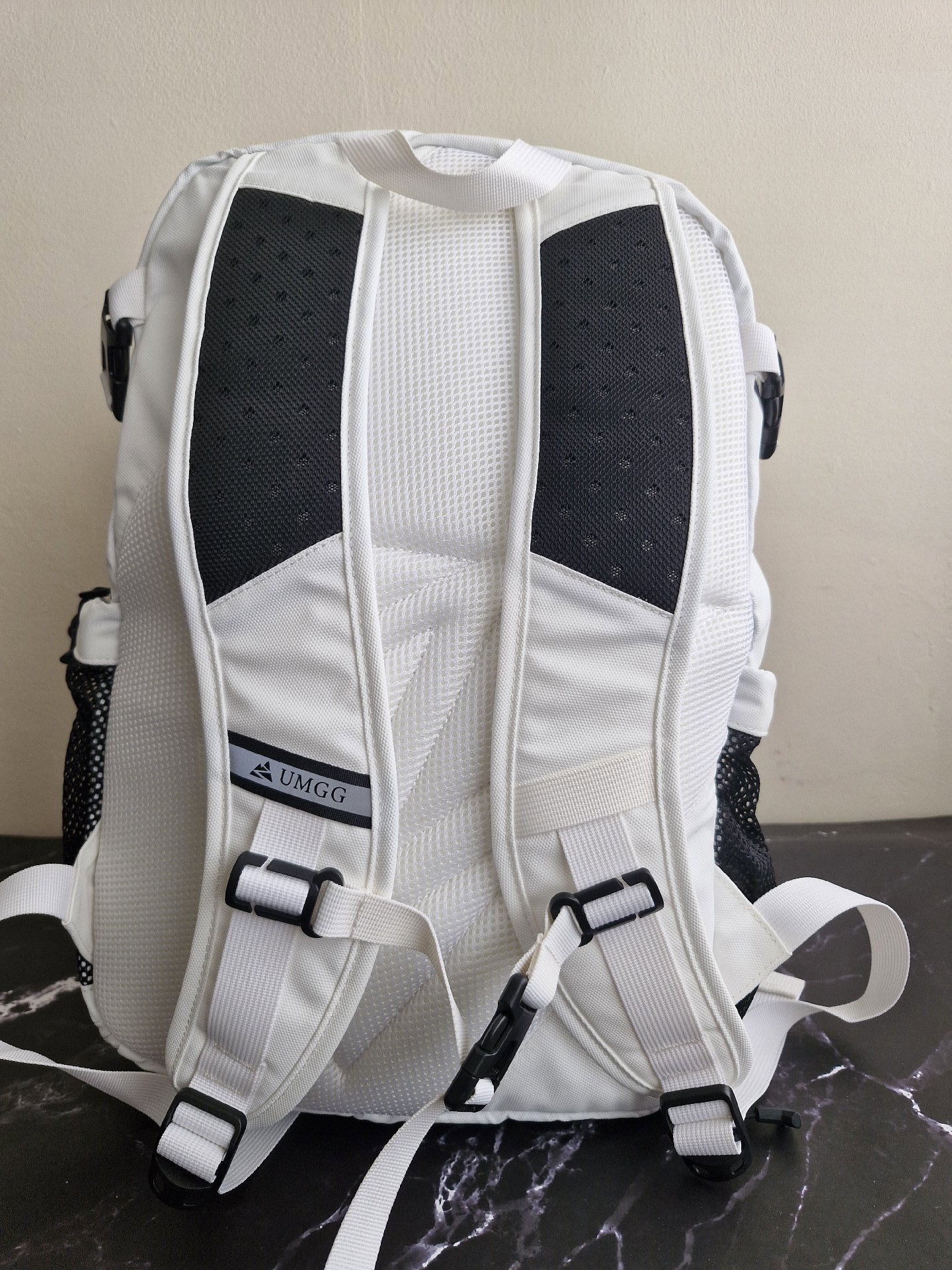 UMGG White Roll Top Backpack with Black Mesh Pockets, Umgg, One Size, New condition — preloved on SilentSale®